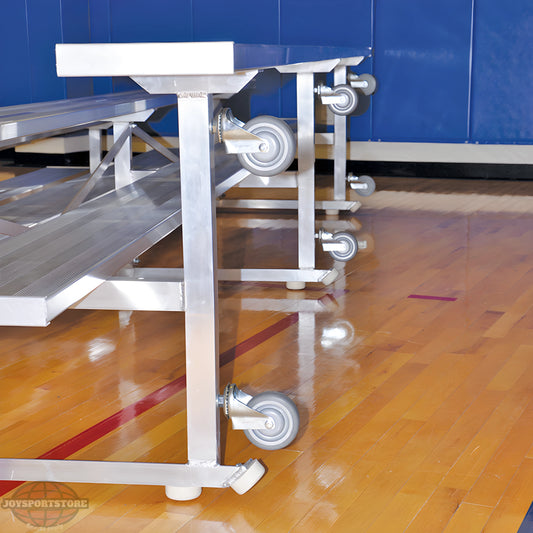 Indoor bleacher seats with aluminum frame and caster wheels on gym floor.