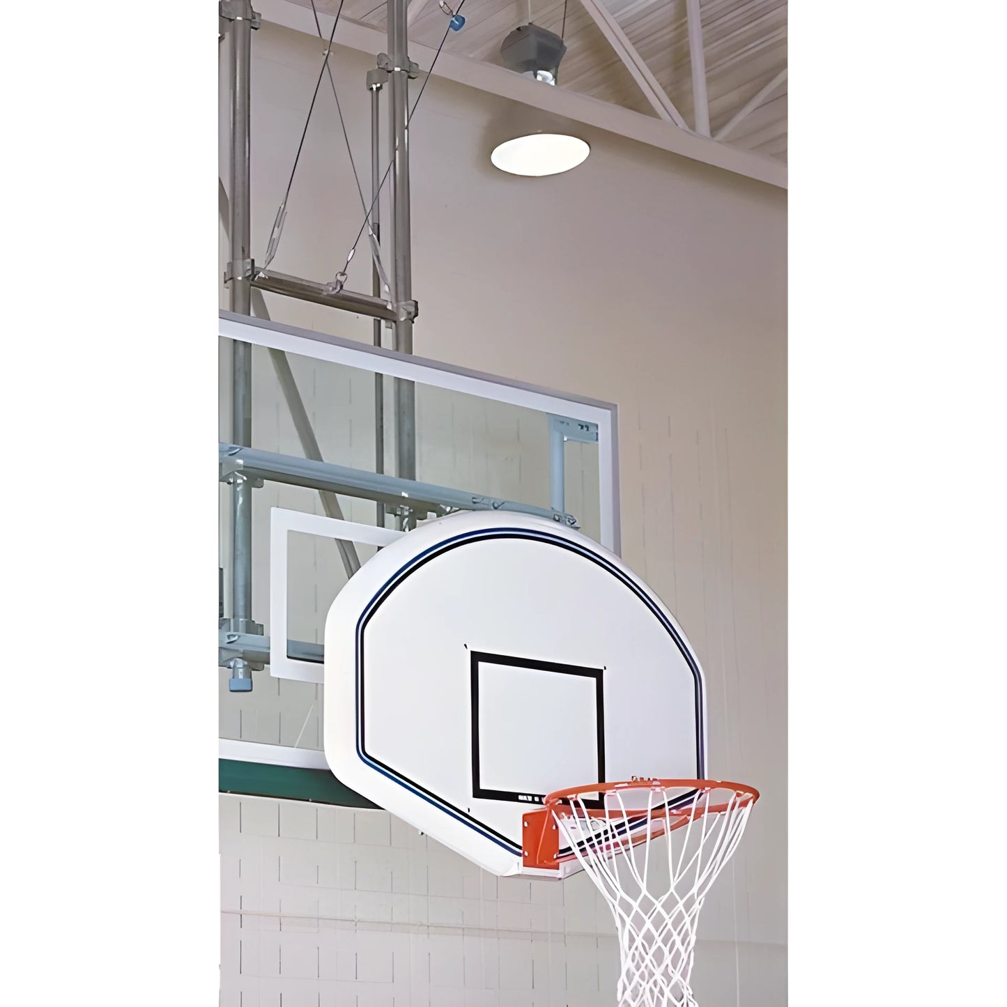 Gared curved white basketball backboard with black markings and orange rim in indoor gym