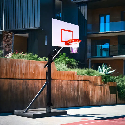First Team Attack Endura In Ground basketball hoop installed outdoors with white backboard and red rim