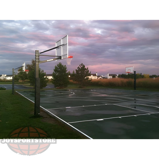 Gared outdoor basketball hoop system installed on an outdoor court at sunset with multiple hoops