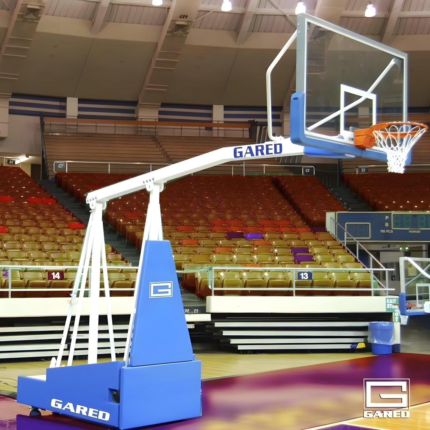 Gared portable basketball hoop with adjustable height set up in an indoor basketball court