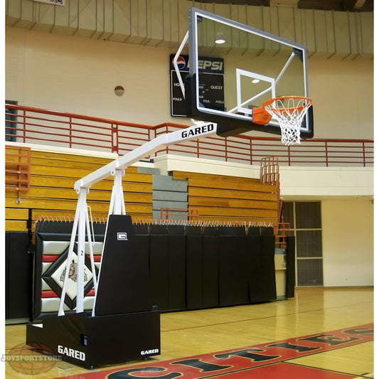 Gared Portable Basketball Hoop with clear backboard and white support stand in indoor gym