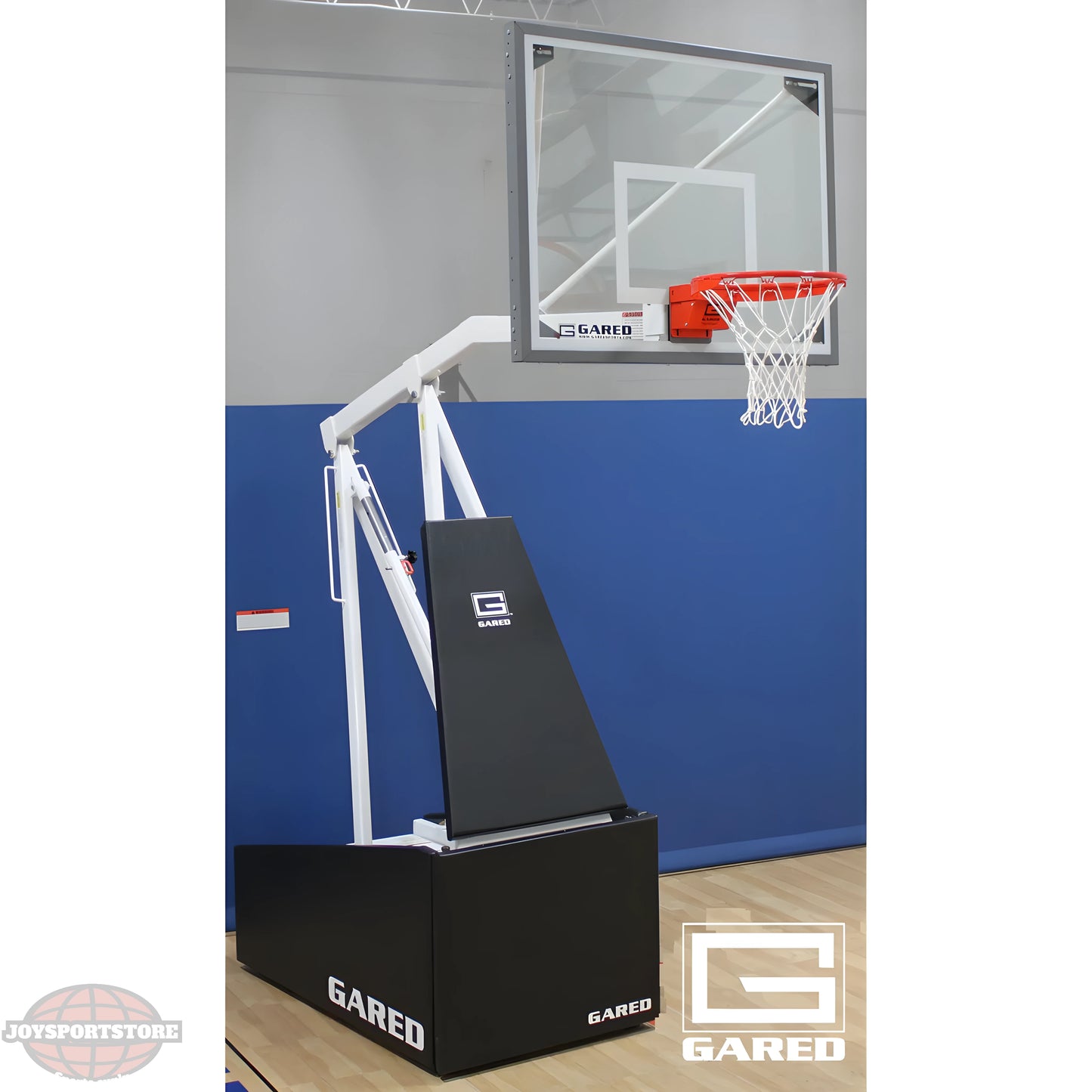 Gared portable basketball hoop with clear backboard and adjustable height on indoor court