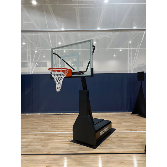 Gared portable basketball hoop with clear backboard and orange rim on indoor gym floor