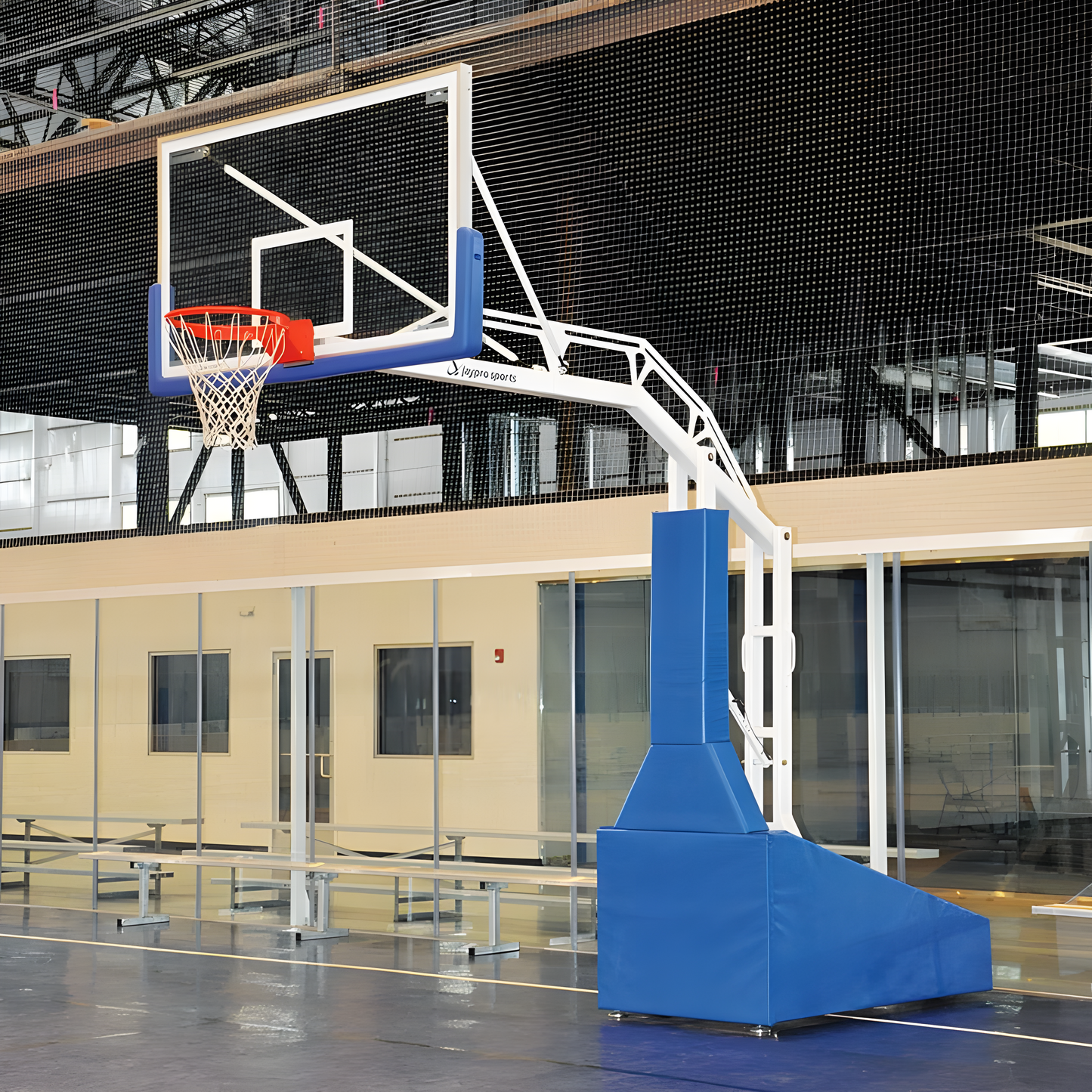 Jaypro portable basketball hoop with padded base and adjustable height in indoor gym setting