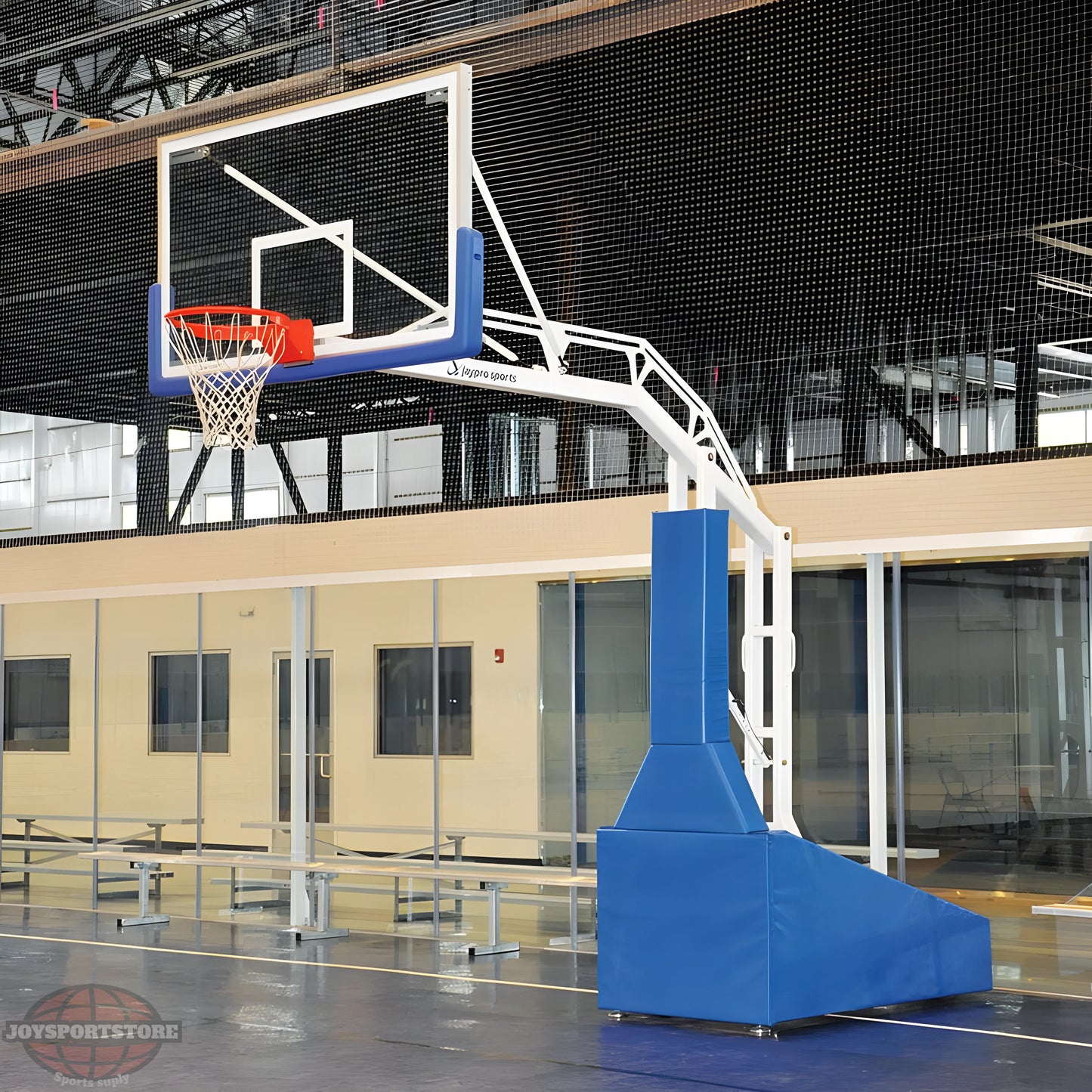 Jaypro portable basketball hoop with padded base and adjustable height in indoor gym setting