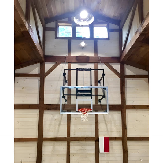 Gared stationary wall mount basketball hoop installed on indoor wooden wall with clear backboard and red net