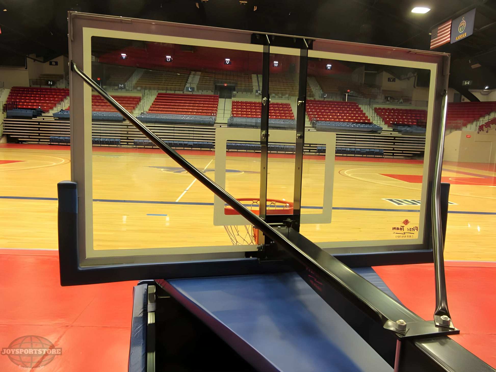 FIRST TEAM portable basketball hoop with clear backboard and sturdy support in indoor gym