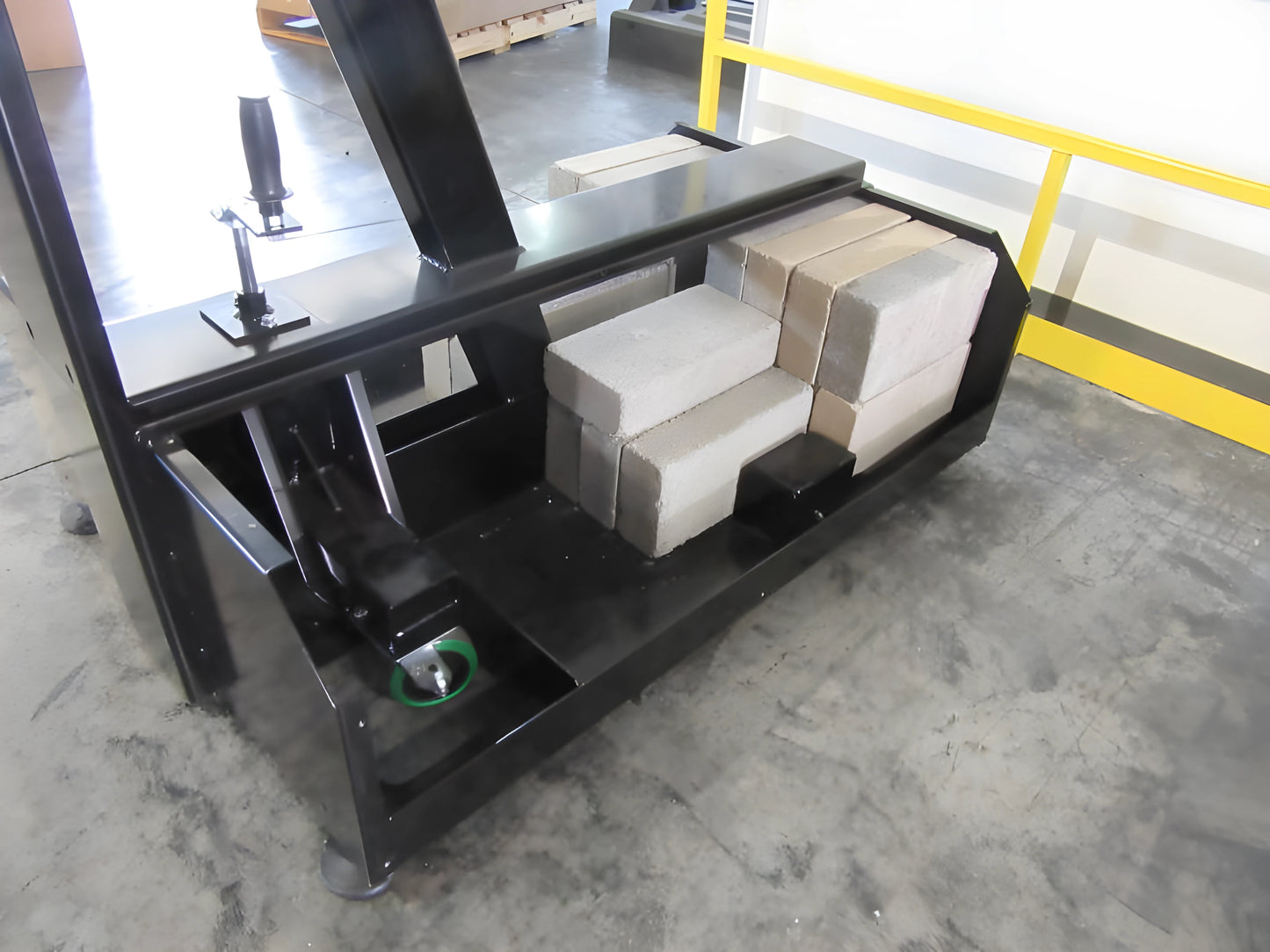 FIRST TEAM portable basketball hoop base filled with concrete blocks for stability on concrete floor