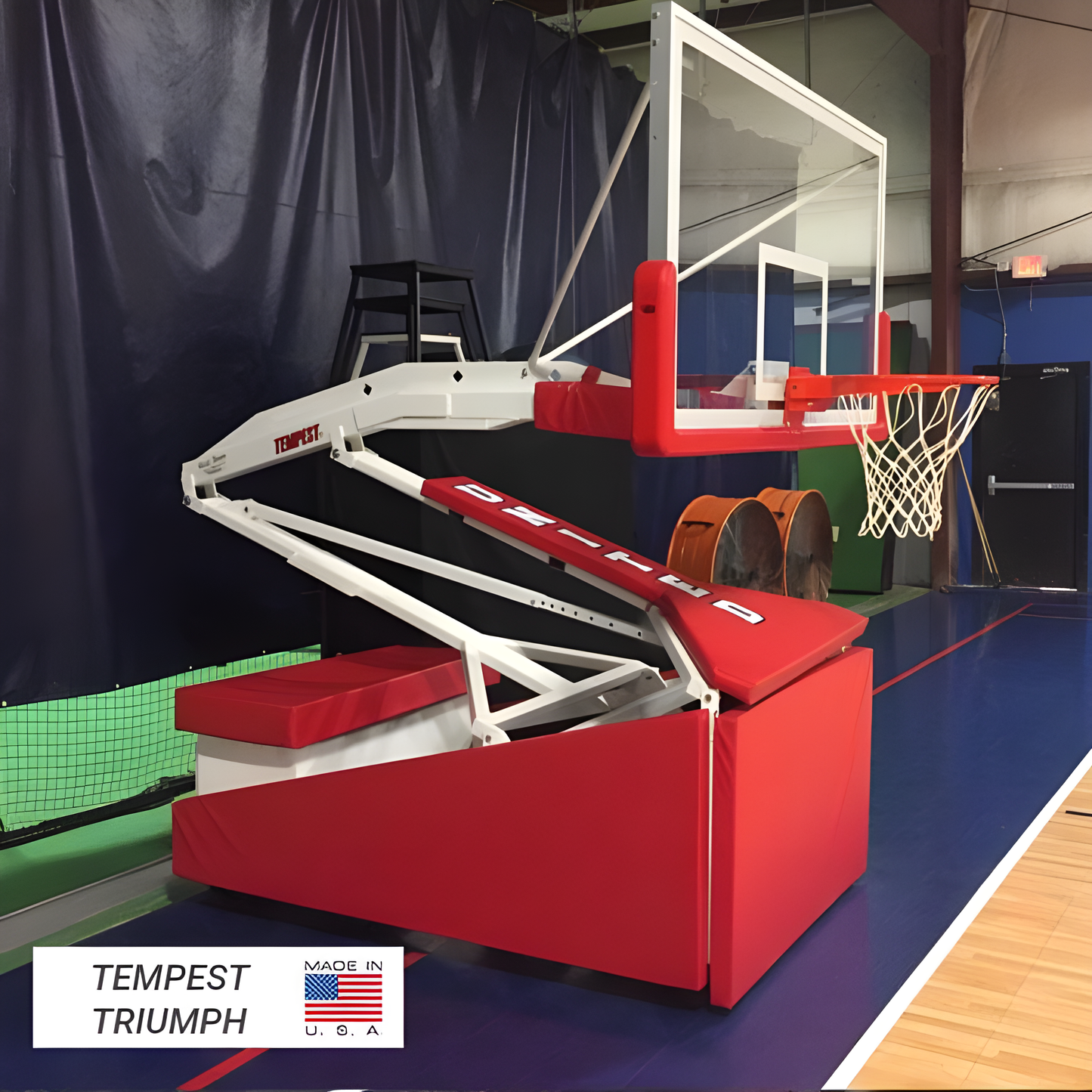 FIRST TEAM Portable Basketball Hoop with Tempest Triumph base and adjustable backboard on indoor court