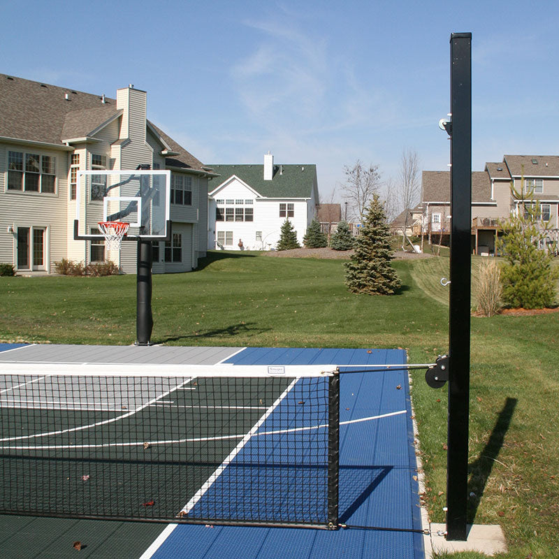 Douglas 4 in. SQ Aluminum Adjustable Net System set at pickleball height on a backyard court