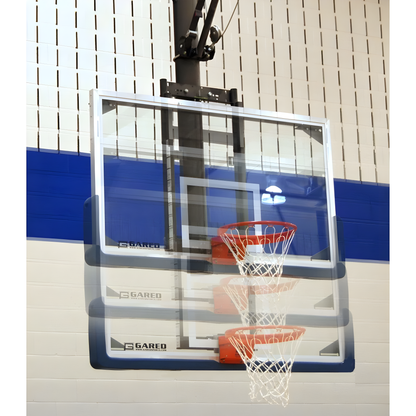 Gared basketball backboard with clear acrylic board and orange rim mounted on indoor gym wall