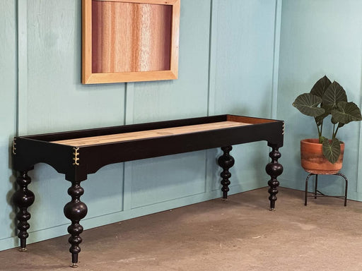 District Mills Victoria Shuffleboard Table in satin black with spool legs and brass corners