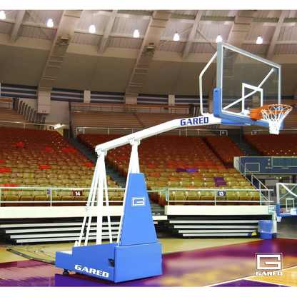 Gared portable basketball hoop with adjustable height and clear backboard on indoor court