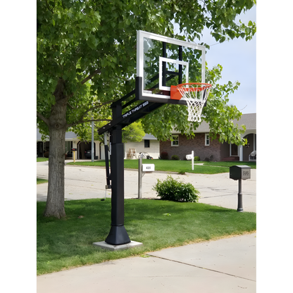 Ironclad In Ground Basketball Hoop with clear backboard and orange rim installed on residential driveway