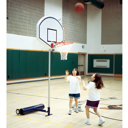 Children playing basketball indoors with Jaypro portable basketball hoop on gym court