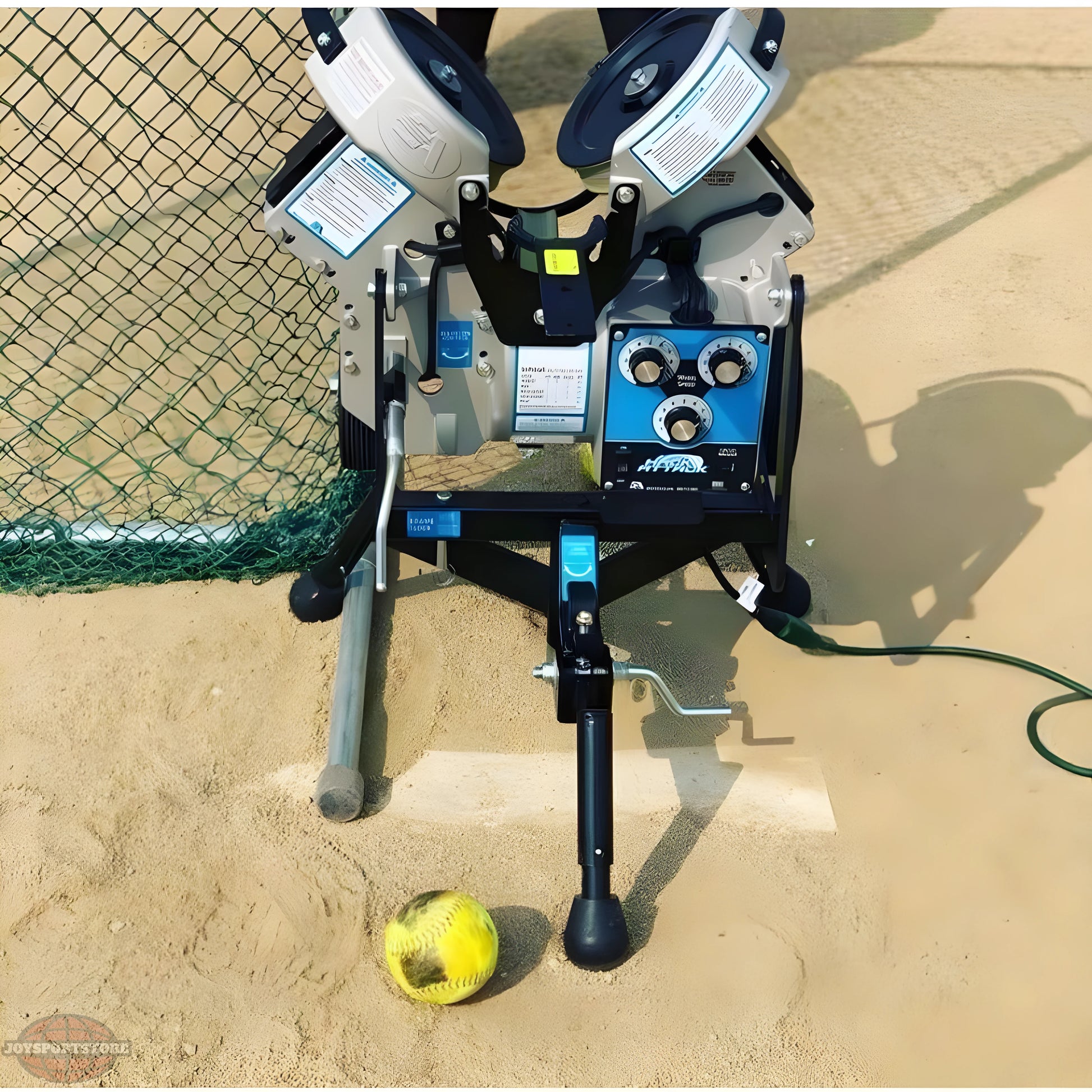 Sports Attack Junior pitching machine with controls and ball ready to launch on the field